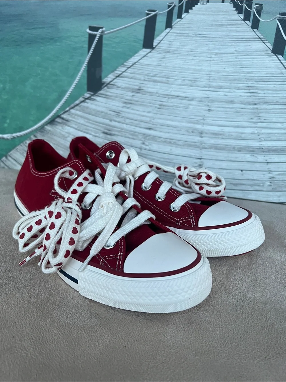 Converse Women's Low Top Sneakers in Burgundy with Heart-Print Laces